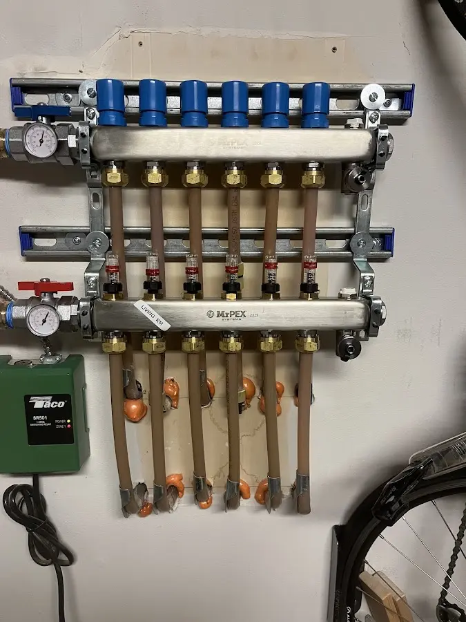 Plumber performing Water Heater Repair at a residential property in Elsa